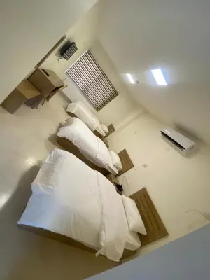 a room with two beds in a room at Al-Mujeb in Kerak