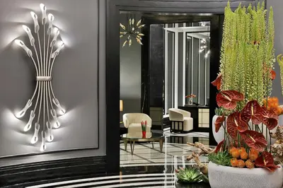 a living room with a table and some plants at The St. Regis Amman in Amman