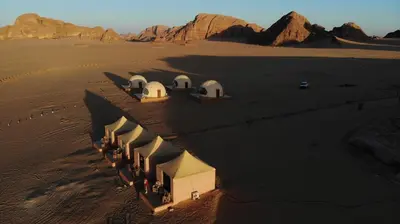 an aerial view of a building in the desert at Rum Jordan camp and tours in Wadi Rum