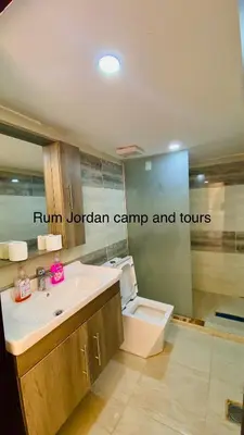 a bathroom with a sink and a toilet at Rum Jordan camp and tours in Wadi Rum