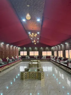 a bowling alley with tables and chairs in a room at Khazali Mountain Camp in Wadi Rum