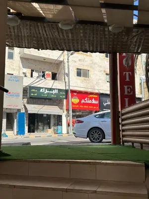 a car parked on a street in front of buildings at Petra Town Check-Inn in Wadi Musa