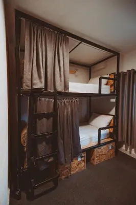 a group of bunk beds in a room at Nomads Hotel in Wadi Musa