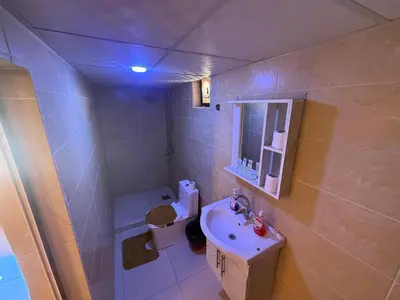a small bathroom with a sink and a toilet at Myra Stars Camp & Tours in Wadi Rum