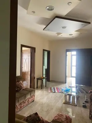 a living room with a couch and a glass table at Darkum Apartment in Wadi Musa