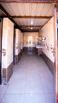 an empty room with a kitchen with sinks in it at Wadi Rum Bedouin Heart in Wadi Rum
