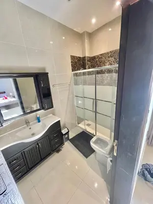a bathroom with a shower sink and a toilet at Villa Mira GuestHouse 2 - Downtown Central Amman - AL DIYRIH in Amman