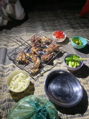 a table topped with plates of food and bowls of vegetables at Wadi Rum night soul Camp in Wadi Rum