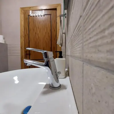 a bathroom sink with a faucet on top of it at The Place in Madaba