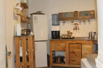 a kitchen with two refrigerators and a refrigerator at Petra Main Gate in Wadi Musa