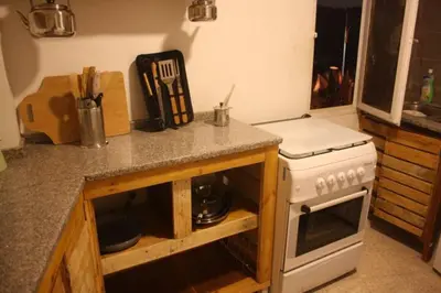 a kitchen with a stove and a counter top at Petra Main Gate in Wadi Musa