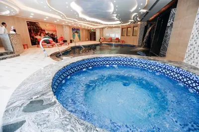 a jacuzzi tub in the lobby of a hotel at Opal Hotel Amman in Amman