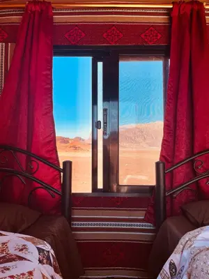 a view of the desert from a train window at Walid Bedouin Camp in Wadi Rum