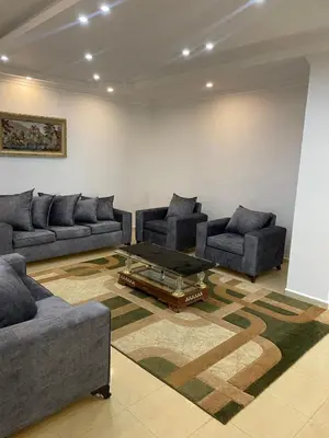 a living room with couches and a coffee table at Oskar Appartment 2 in Wadi Musa