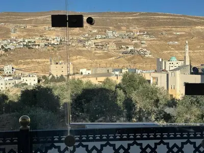 a view of a city with a camera at Amro Petra Apartment in Wadi Musa