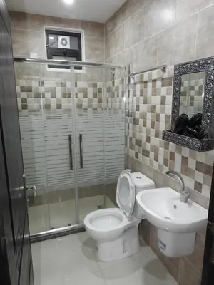 a bathroom with a toilet and a sink at Amro Petra Apartment in Wadi Musa