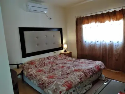a bedroom with a bed and a window at Horizon in Wadi Musa