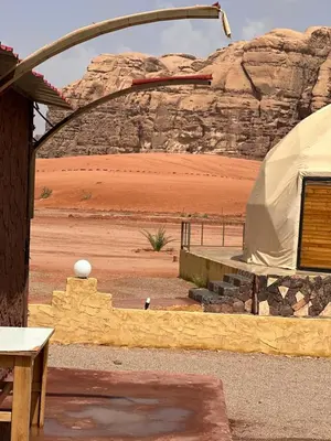 a tent in the middle of a desert with a mountain at Wadi Rum Nova camp in Wadi Rum