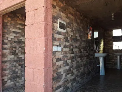 a brick wall with a sink in a room at WadiRum Mobile Camp in Wadi Rum