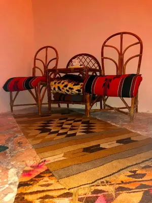 two chairs and a couch in a room at The Orient Home in Wadi Musa