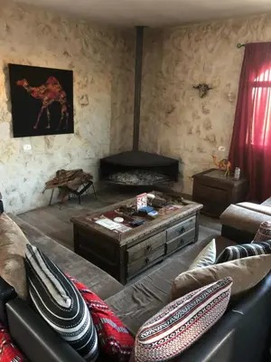 a living room with a couch and a coffee table at Infinity Lodge in Wadi Musa