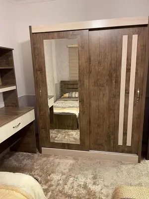 a large mirror in a bedroom with a bed at شركة مسايا لشقق المفروشة in Irbid