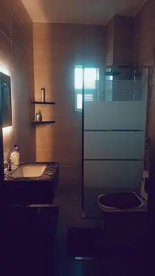 a bathroom with a tub and a toilet and a sink at Bubble castle in Kerak