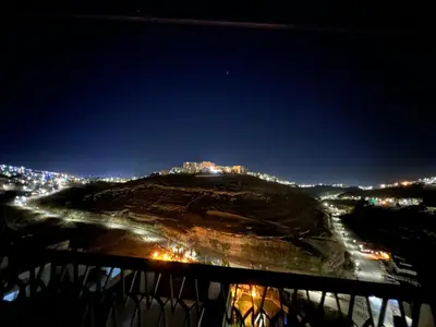 a view of a city at night at the old house in Kerak