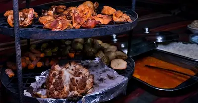 a display of different types of food on a shelf at One Thousand and One Nights Camp in Wadi Rum