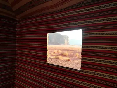 a window in a room with a view of the beach at Wadi Rum in Wadi Rum