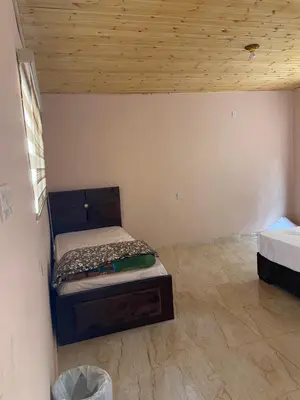 a bedroom with a bed and a wooden ceiling at Real Bedouin life &tour in Wadi Rum