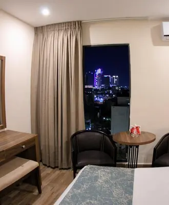 a room with a window with a view of a city at Post Boutique Hotel Amman in Amman