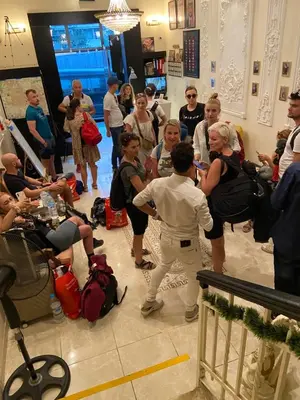 a group of people standing around in a room at City Citadel Hotel,Amman in Amman