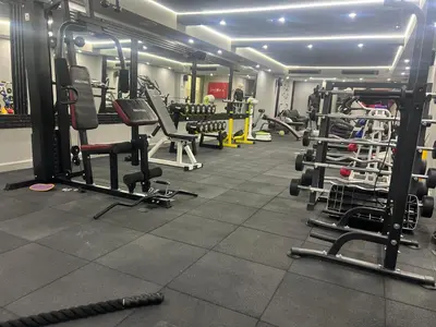 a gym with lots of equipment in a room at Mount Nebo Hotel & Restaurant Madaba City Center in Madaba
