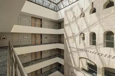 an interior view of a building with a glass ceiling at Signia by Hilton in Amman