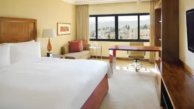 a hotel room with a bed and a desk at InterContinental Amman Jordan by IHG in Amman