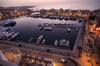 a view of a marina with boats in the water at Gorgeous Pool View Apartment - Tala Bay Resort, Aqaba in Aqaba