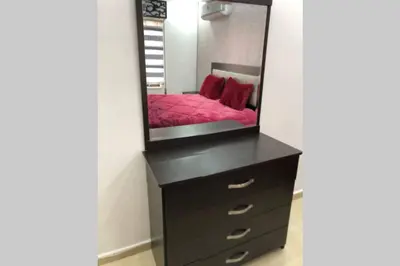 a dresser with a mirror on top of it at Apt 4 rent/A quiet neighborhood close to services in Amman