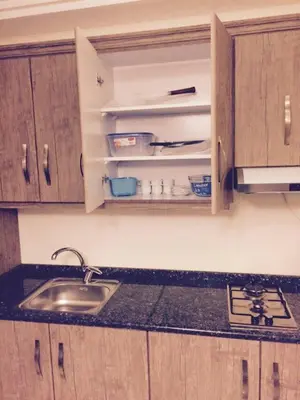 a kitchen with a sink and a counter top at The Royal Luxury King Terrace 1 in Amman