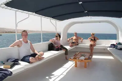 a group of people sitting on the back of a boat at The Royal Luxury Superior King in Amman