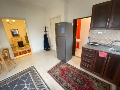 a kitchen with a stainless steel refrigerator and a counter at ROYAL Real ESTATE in Amman