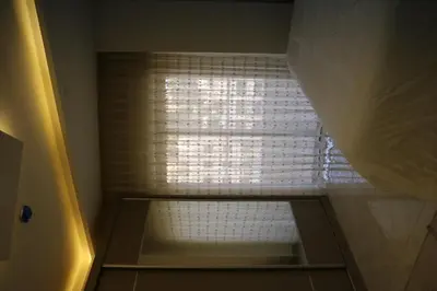 a small bathroom with a window in a shower at Amazing one Bedroom Apartment in Amman Elwebdah 7 in Amman
