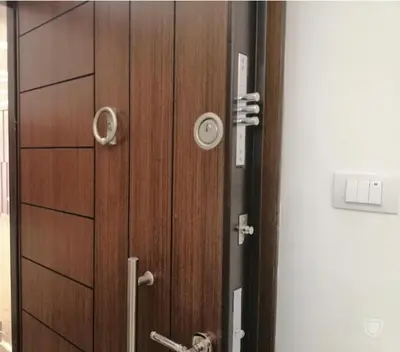 a wooden door with a handle in a room at Amazing one Bedroom Apartment in Amman Elwebdah 8 in Amman