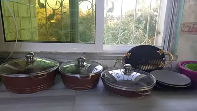 a group of pots and pans sitting next to a window at moon valley site jerash in Jerash