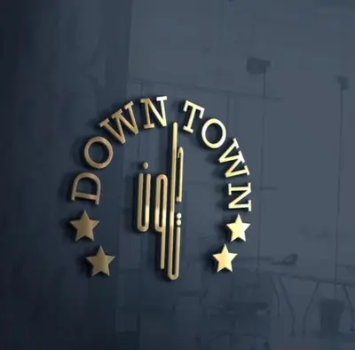 a neon sign that reads winn town at Downtown Hotel للعائلات فقط in Aqaba