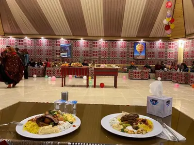 two plates of food on a table in a room at Maraheb Luxury camp in Wadi Rum