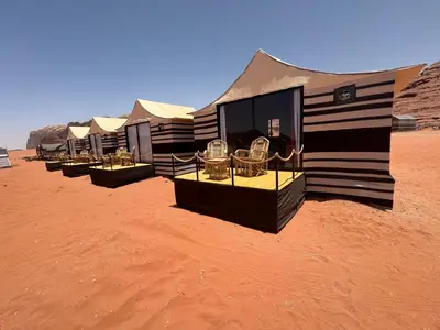 a row of luxury tents in the desert at Luxury Desert & Bedouin Adventure in Wadi Rum