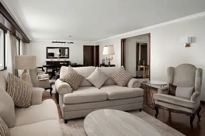 a living room with a couch and chairs at Amman Marriott Hotel in Amman