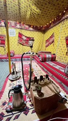 a room with a table with a tea kettle on it at Omar Apartment in Wadi Musa