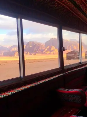 a window in a room with a view of the desert at joy of life Camp in Wadi Rum